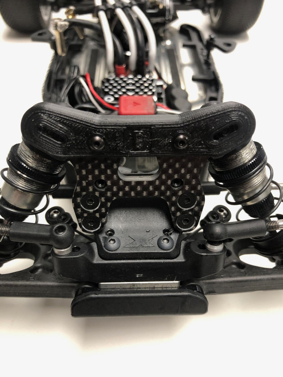 RC ONE FRONT SHOCK TOWER COVER XB2 '24